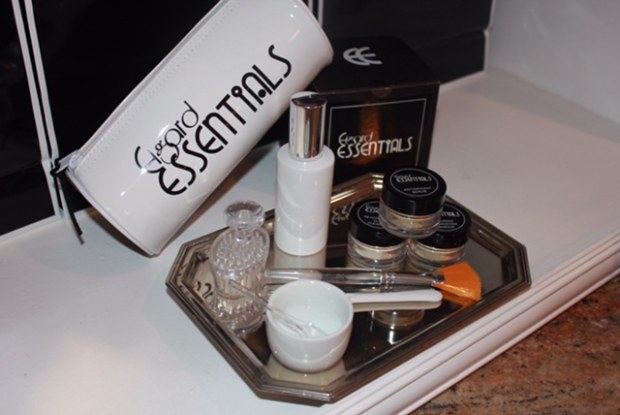 A tray with some makeup and other items on it