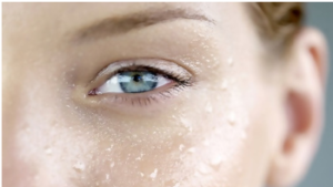 A close up of the eye with water on it