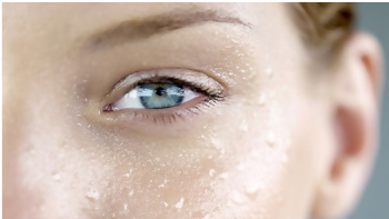 A close up of the eye with water on it